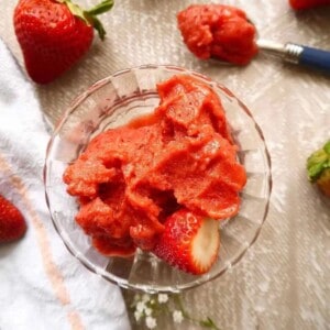 Strawberry mango sorbet in a cup.