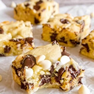 White chocolate brownies with a bite taken out of it.
