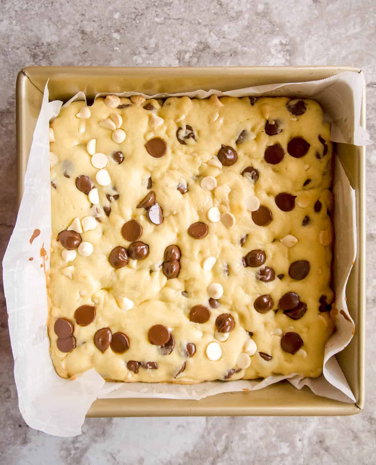 White chocolate brownies in a pan after baking.