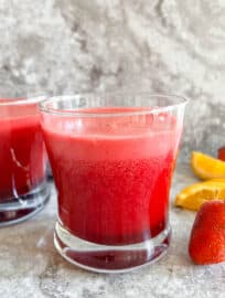 A fresh strawberry beet and carrot juice in two glasses.