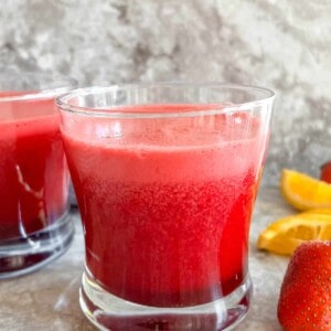 A fresh strawberry beet and carrot juice in two glasses.