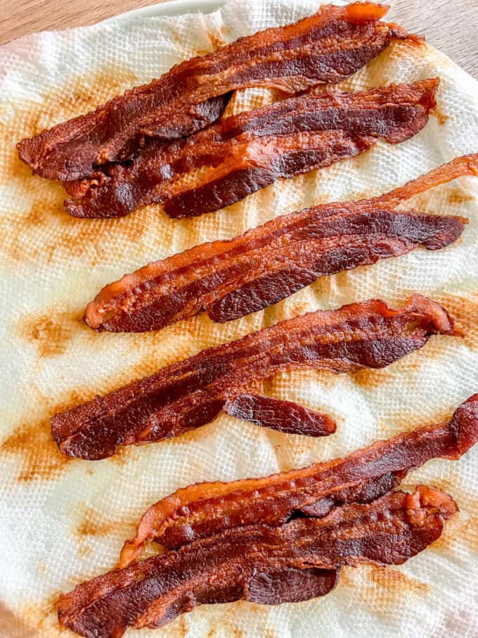 Bacon slices cooked in the microwave.