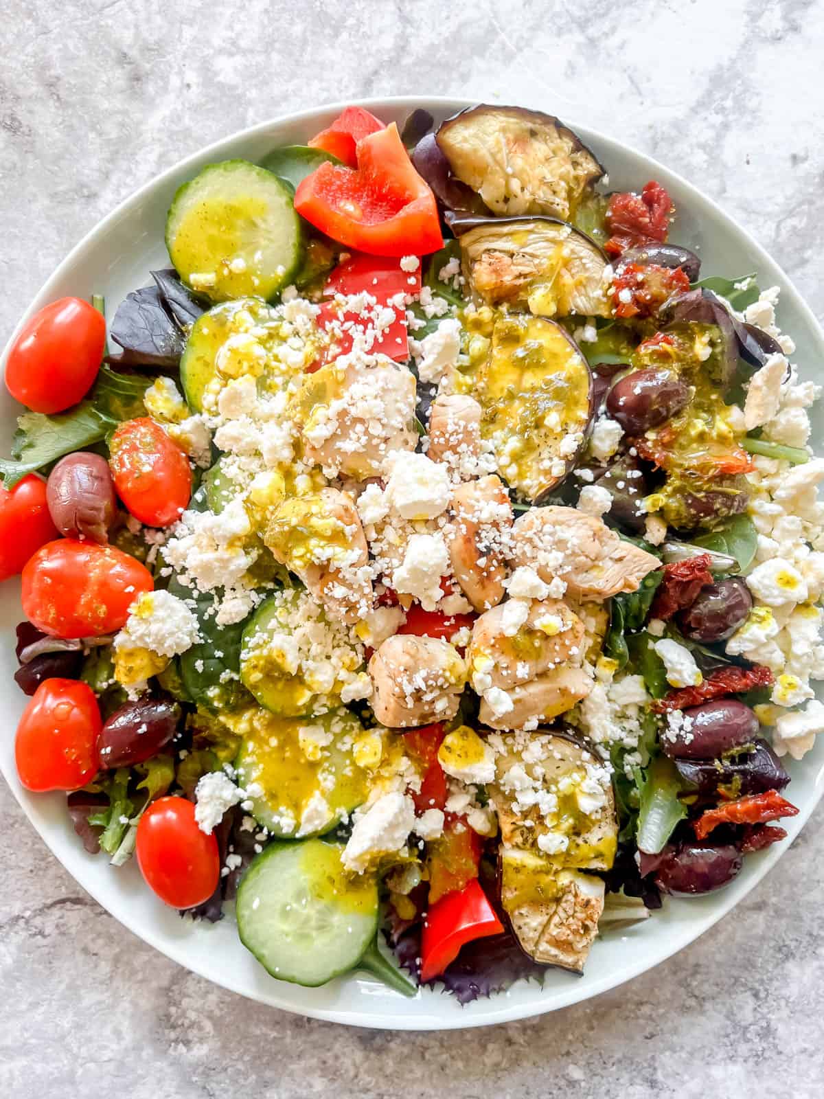 Feta and dressing added to the salad.