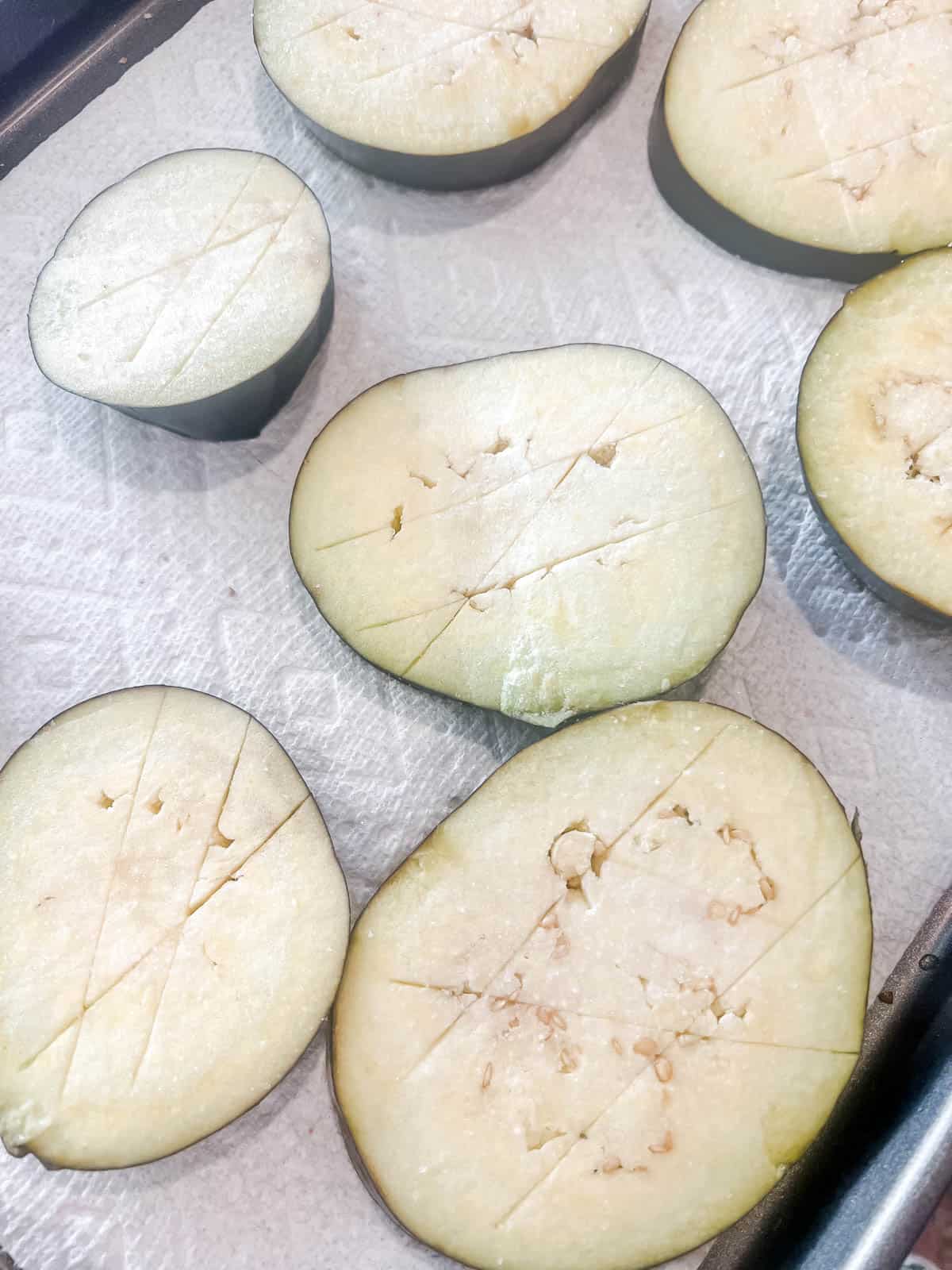 The eggplant with salt on top to remove excess moisture.