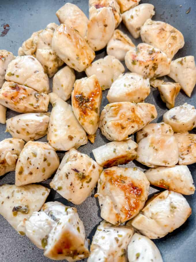 The lemon oregano chicken grilled in a pan.