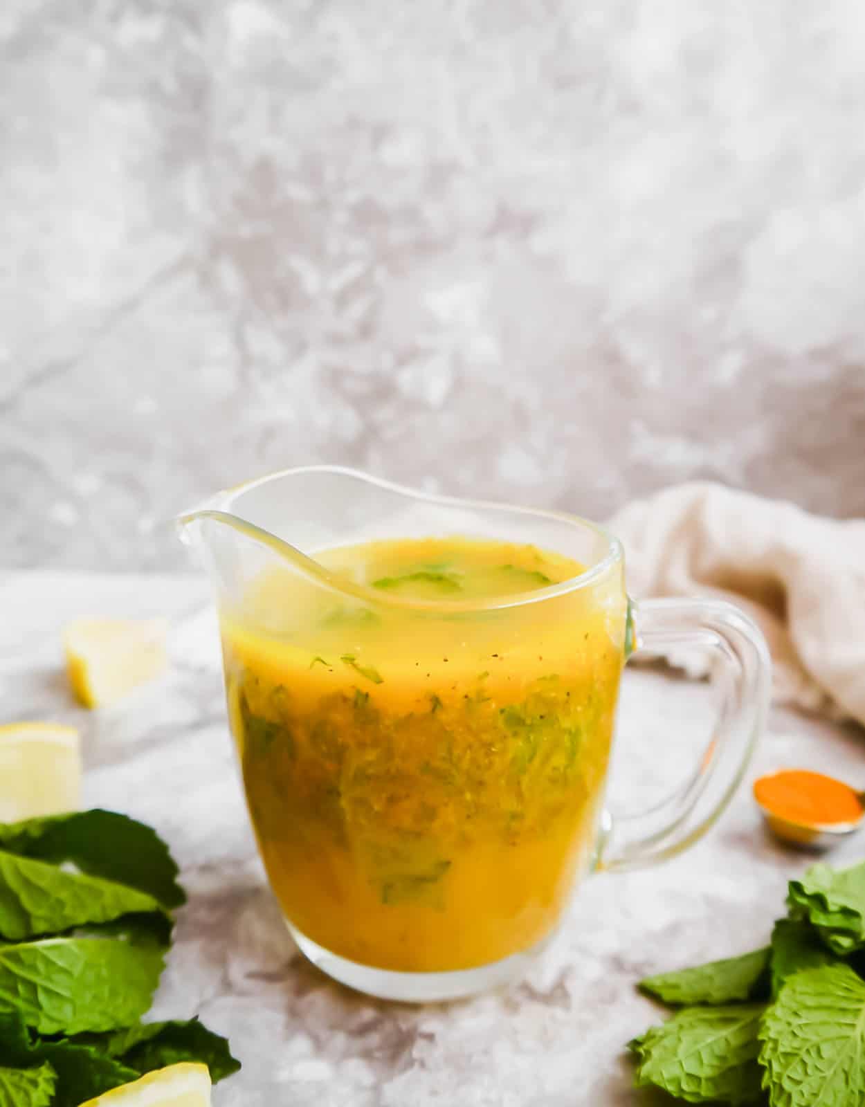 Lemon turmeric dressing in a container.