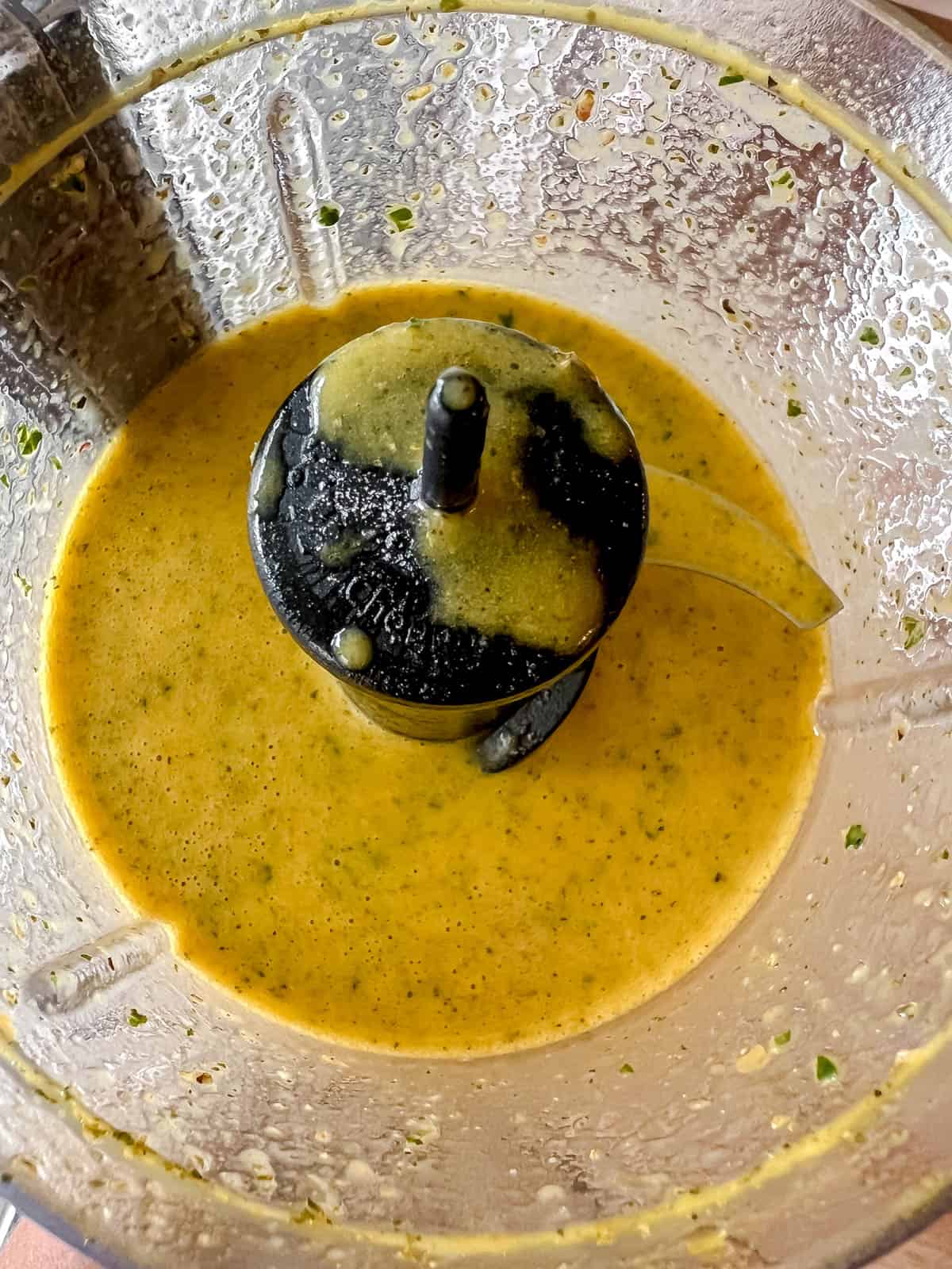 Salad dressing with turmeric all mixed together in food processor.