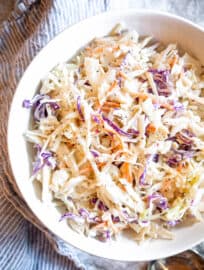 Paleo coleslaw in a bowl on a table.