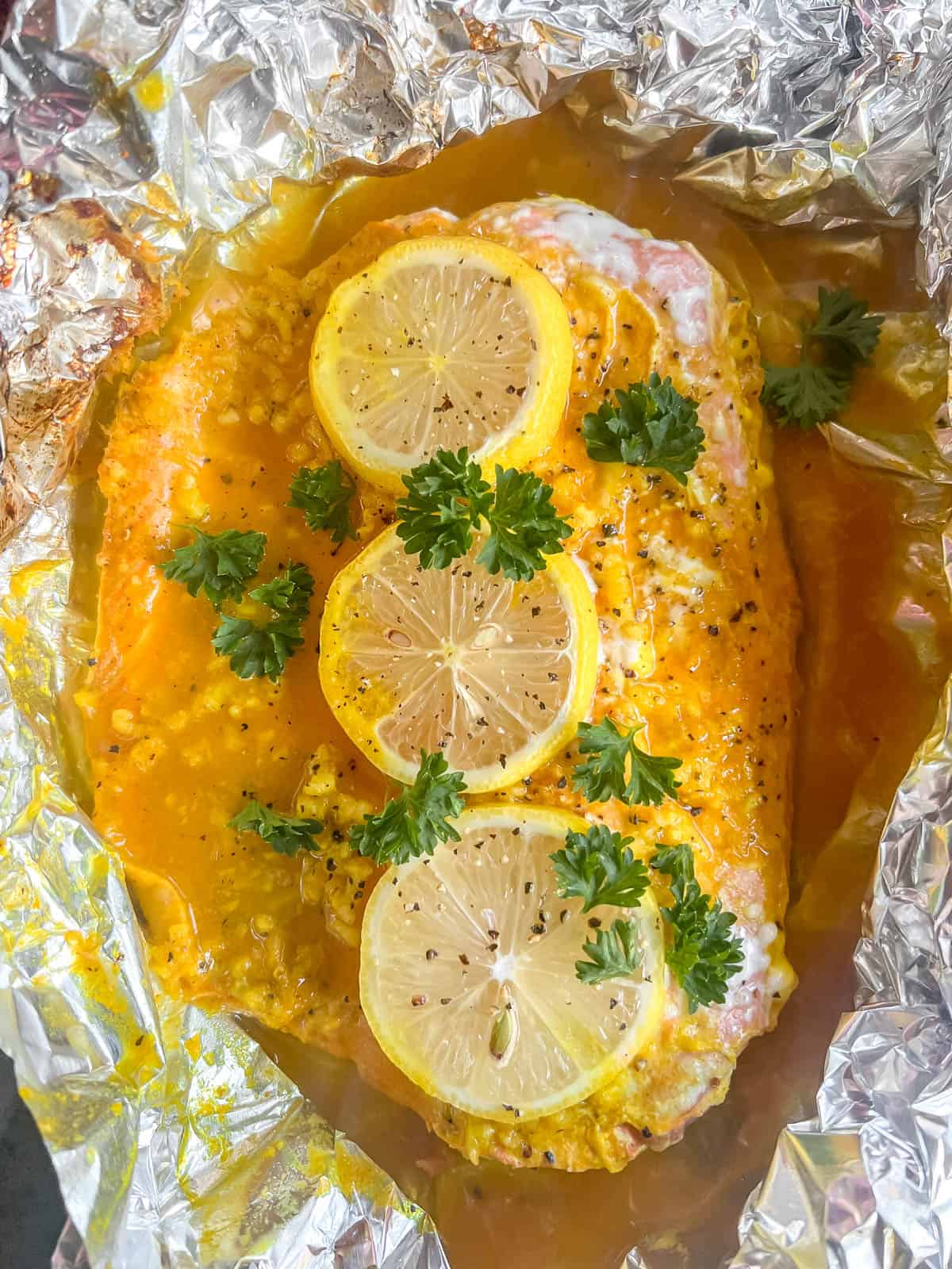 Baked turmeric salmon in foil just out of oven.