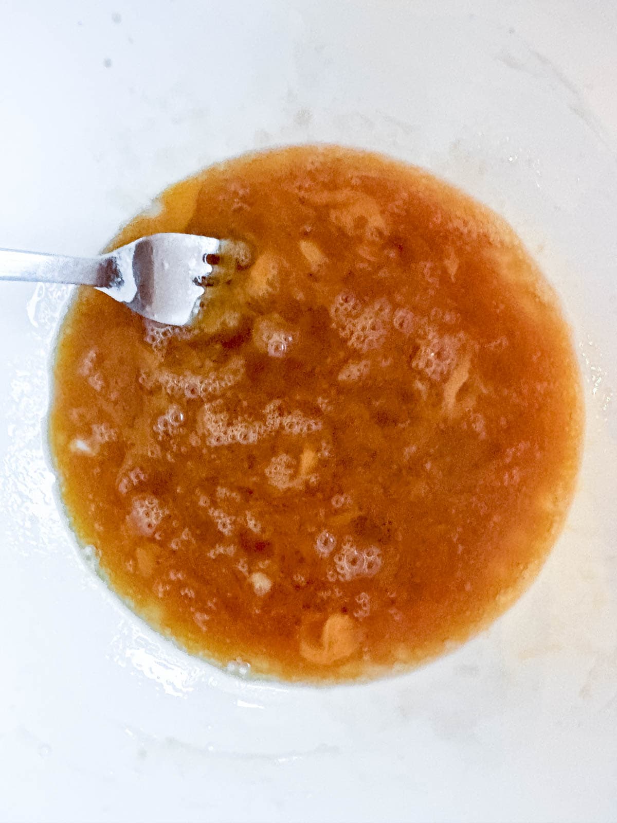 Wet ingredients for coffee cake in a bowl.