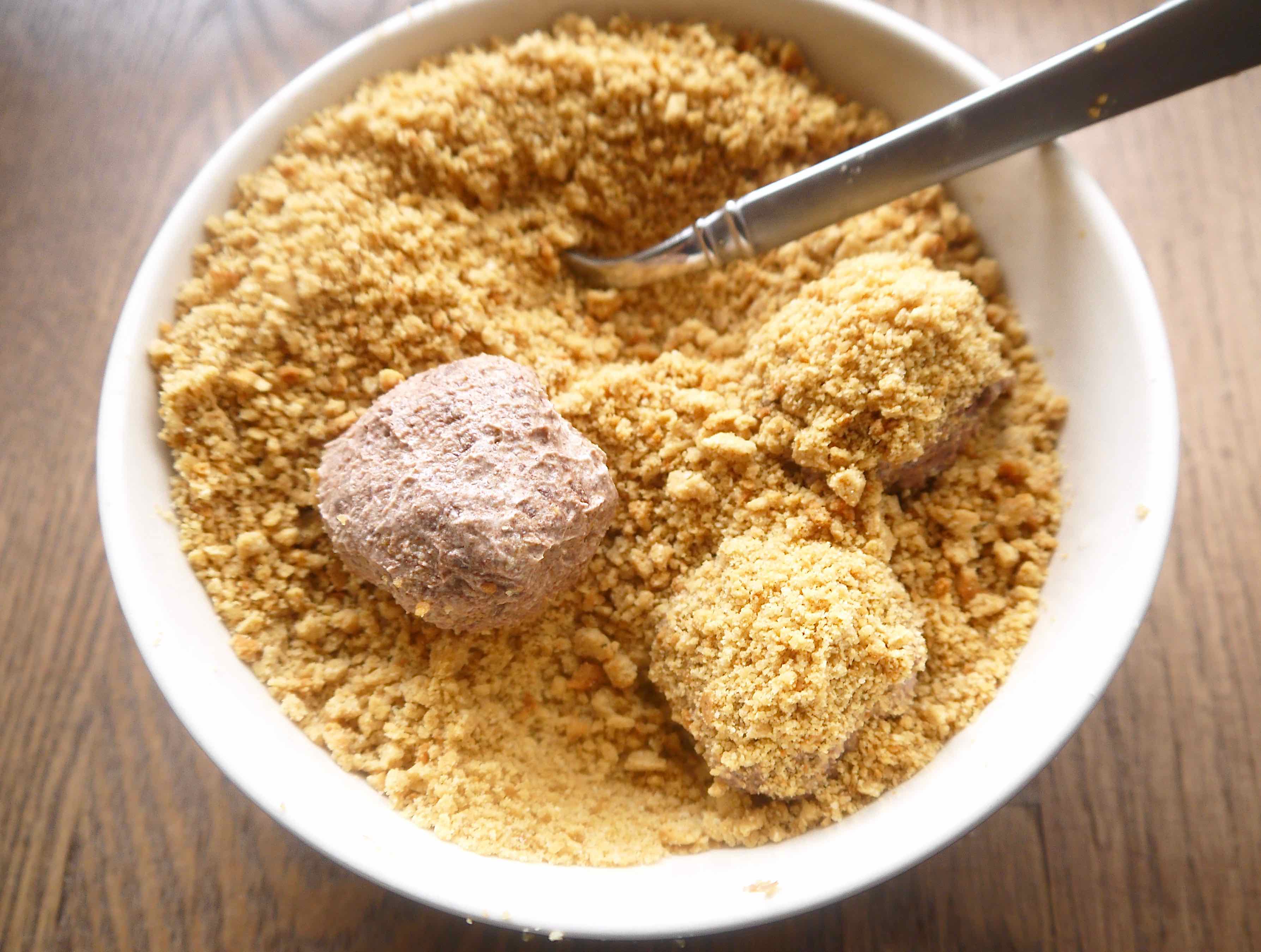 Paleo mousse rolled into a ball and put into cookie crumbs, rolled again and covered in crumbs again.
