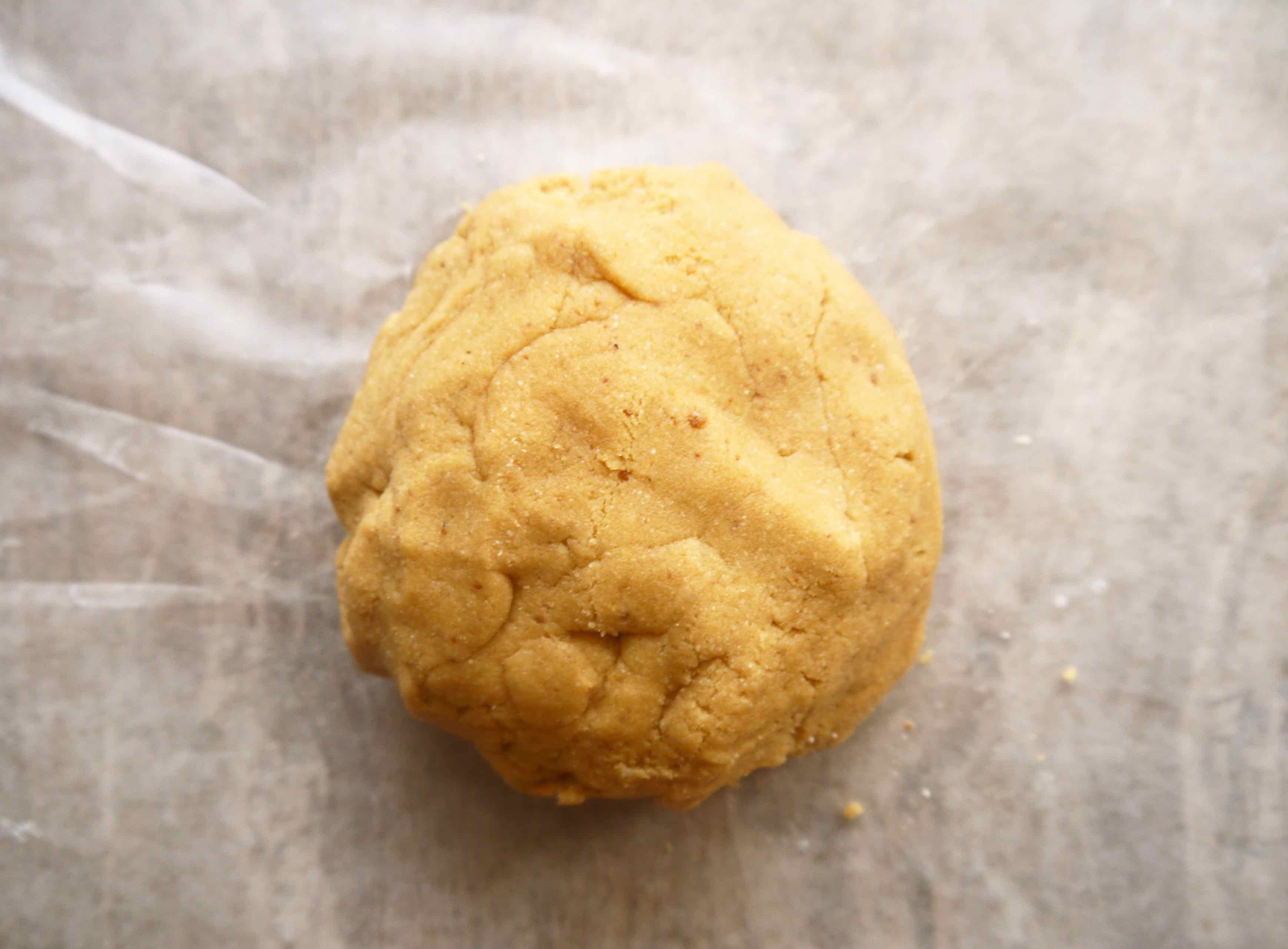  Cookie dough rolled into a ball.
