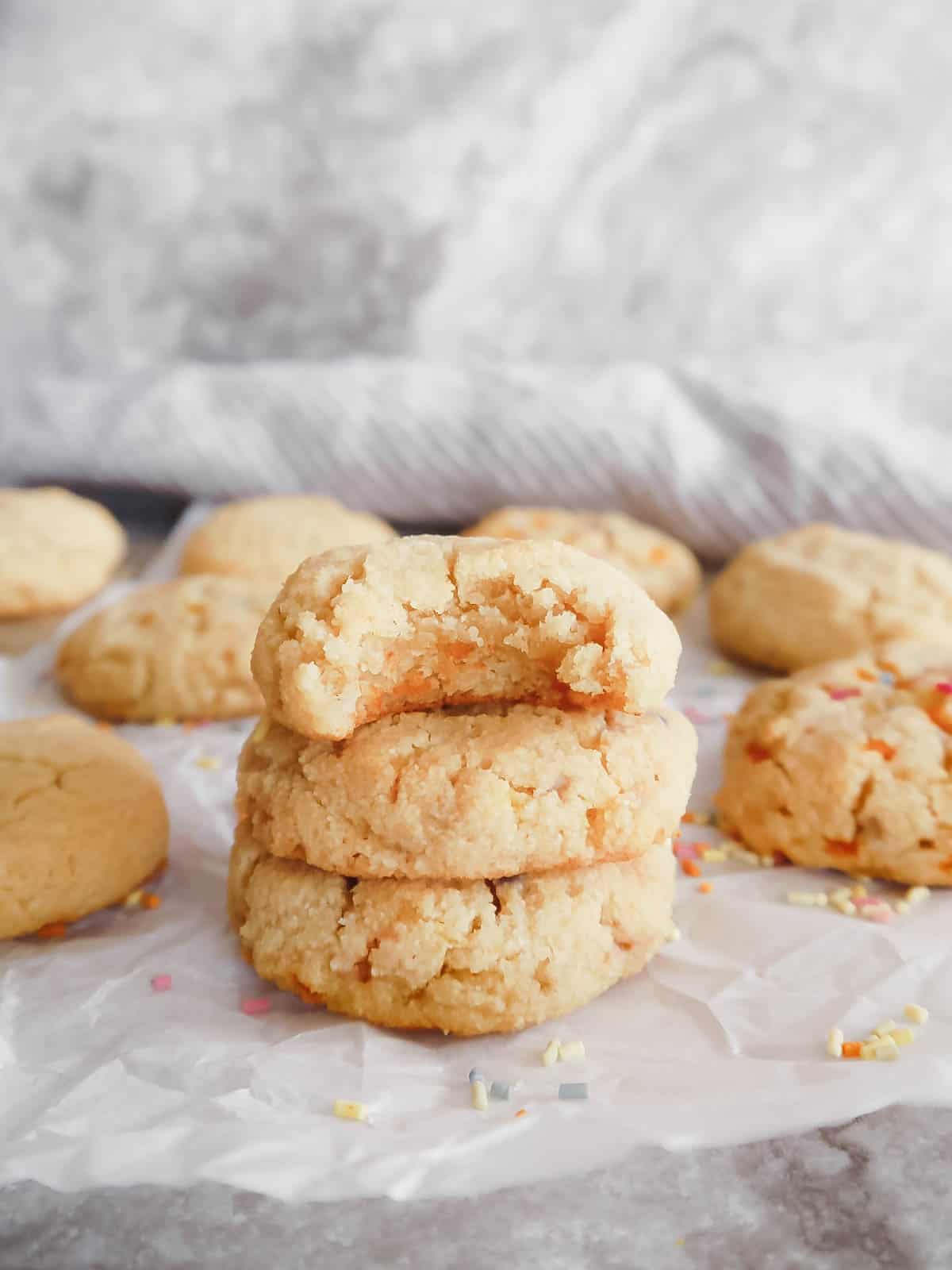 Three paleo sugar cookies stacked on top of each other. 
