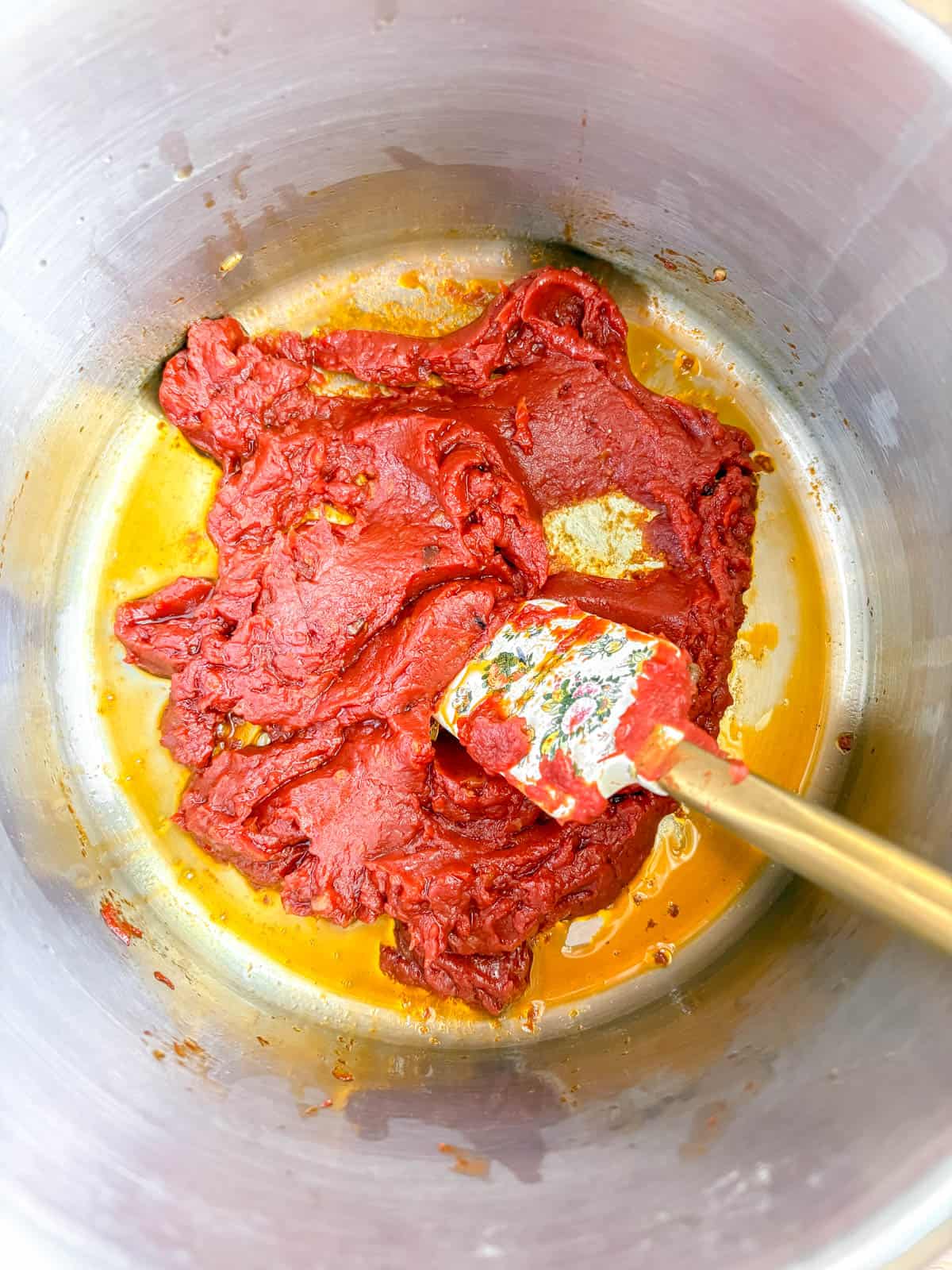 Tomato paste added to the pan.