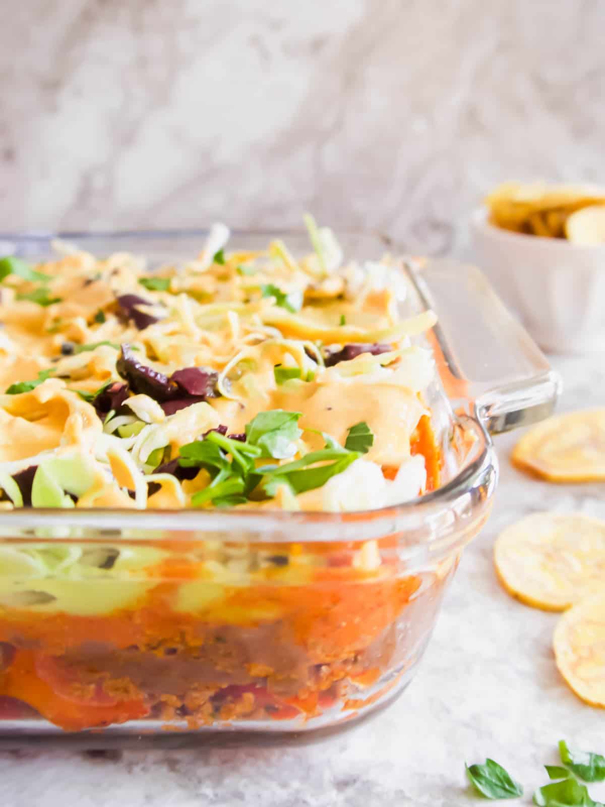 Side angle of healthy taco dip where you can see all the layers.