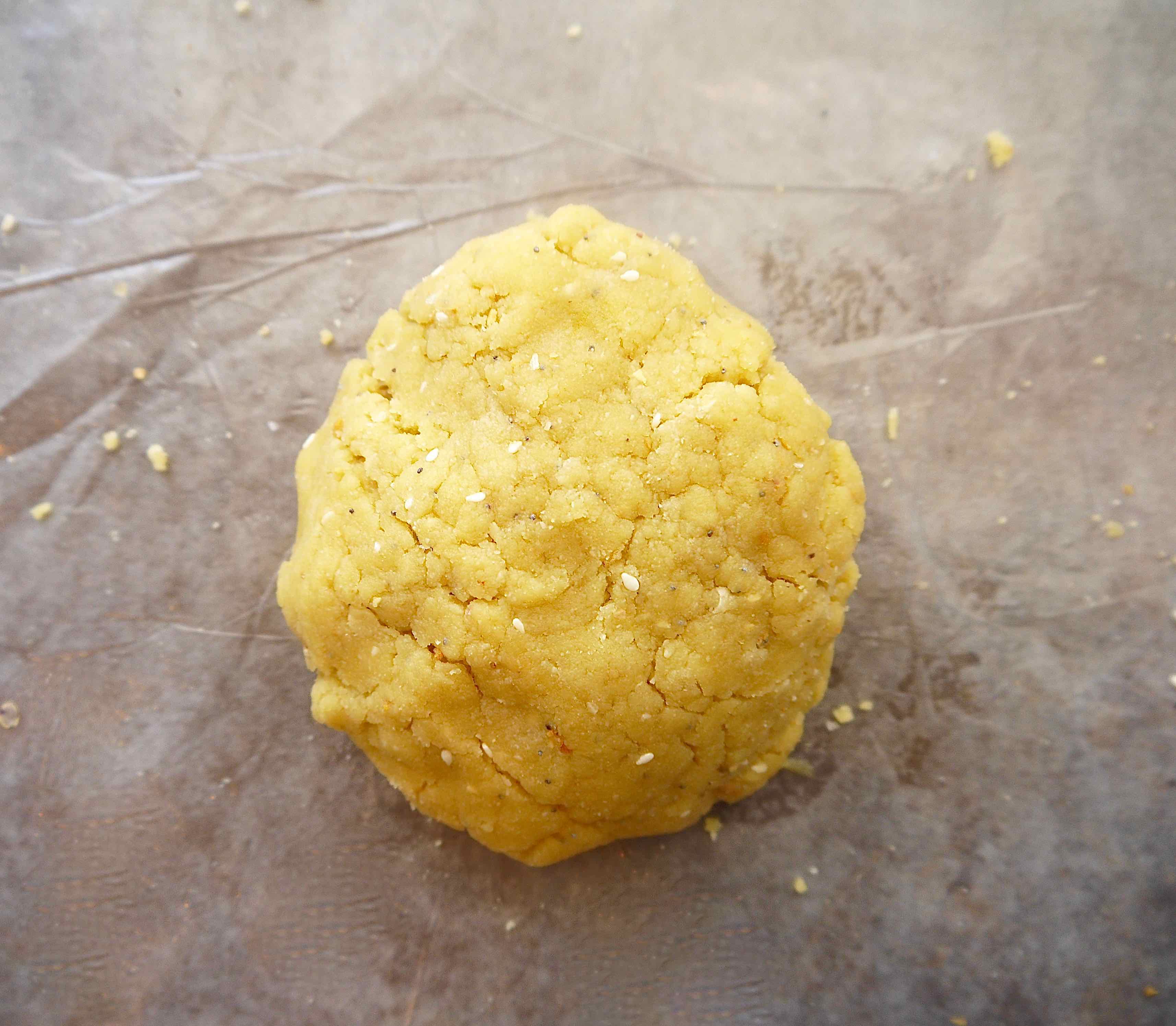 Almond flour cracker dough on table.