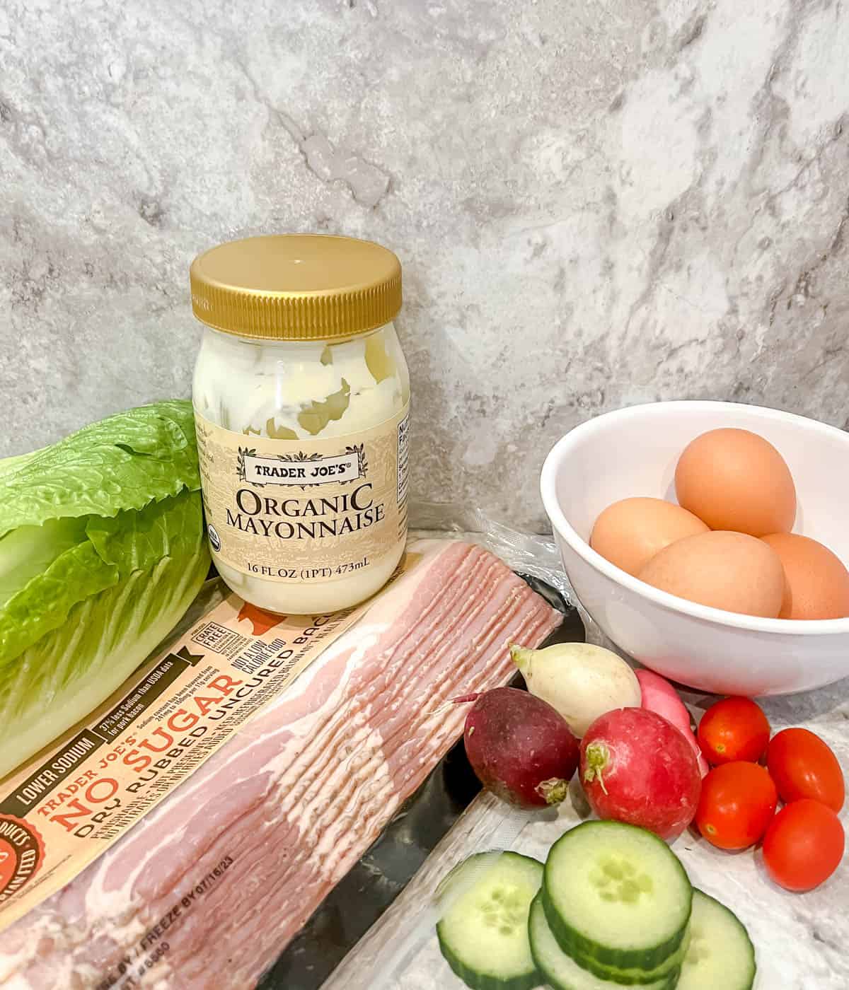 Ingredients needed to make egg salad wraps.