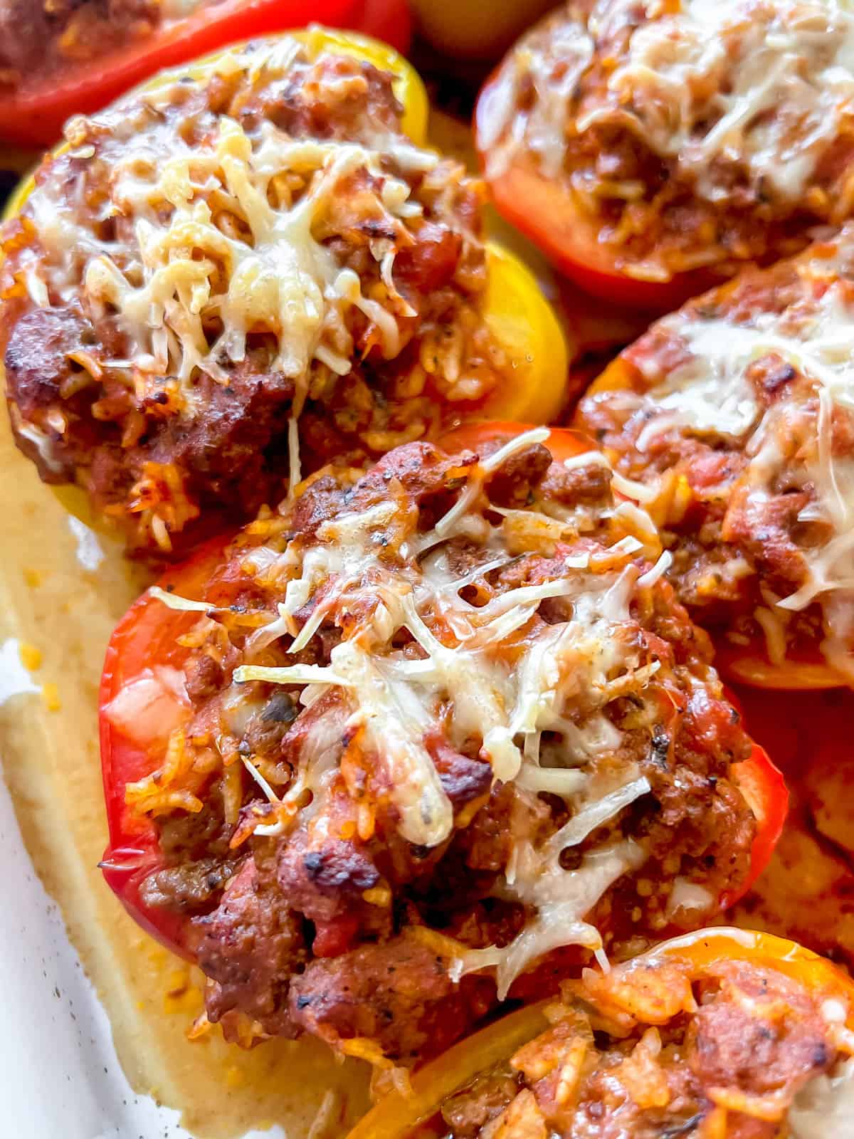 Healthy stuffed peppers with melted cheese on top freshly cooked.