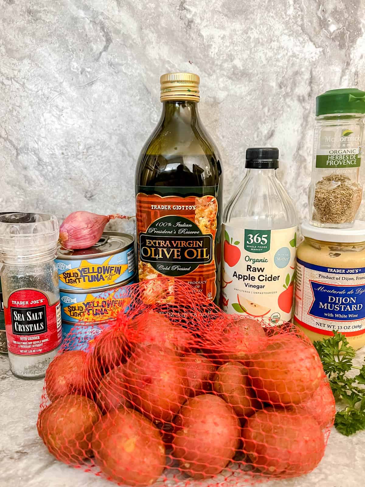 Ingredients needed to make tuna potato salad.