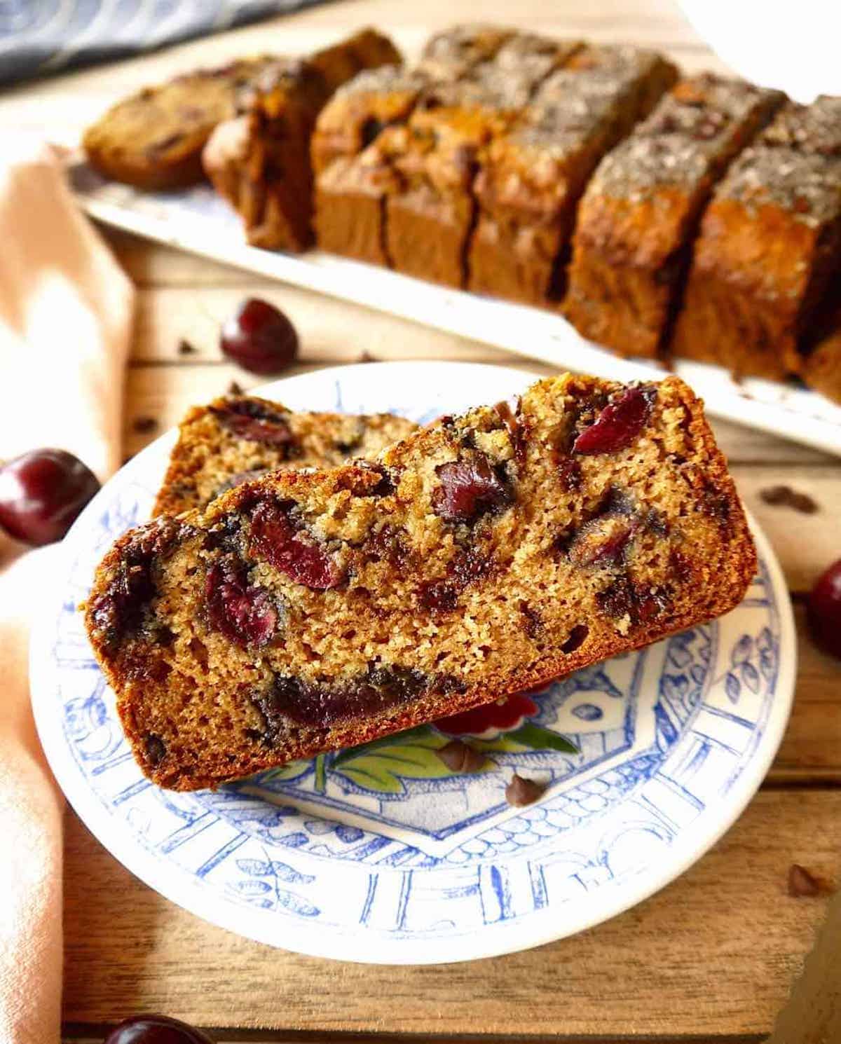 Gluten Free Cherry Banana bread with chocolate chips on a plate.