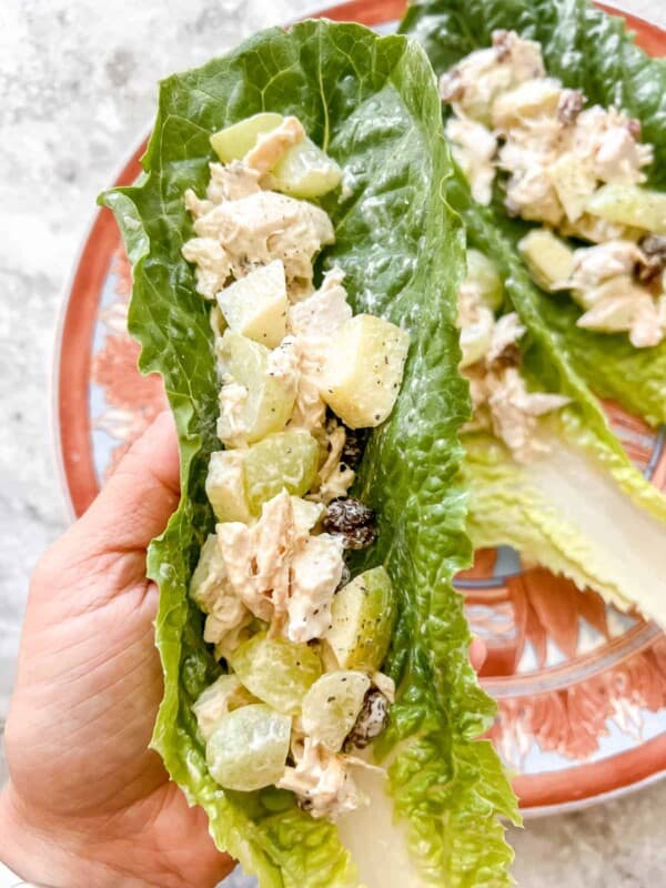 Healthy Rotisserie Chicken Salad Lettuce Wrap being held in someone's hands.