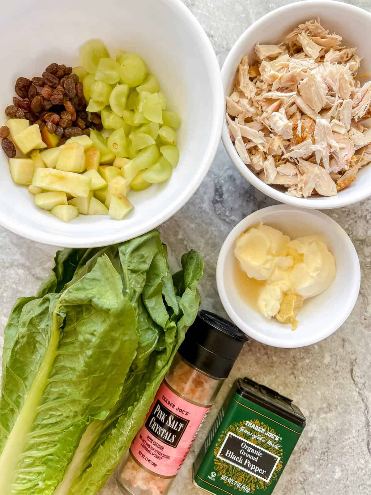 Chicken salad lettuce wraps ingredients on a table.