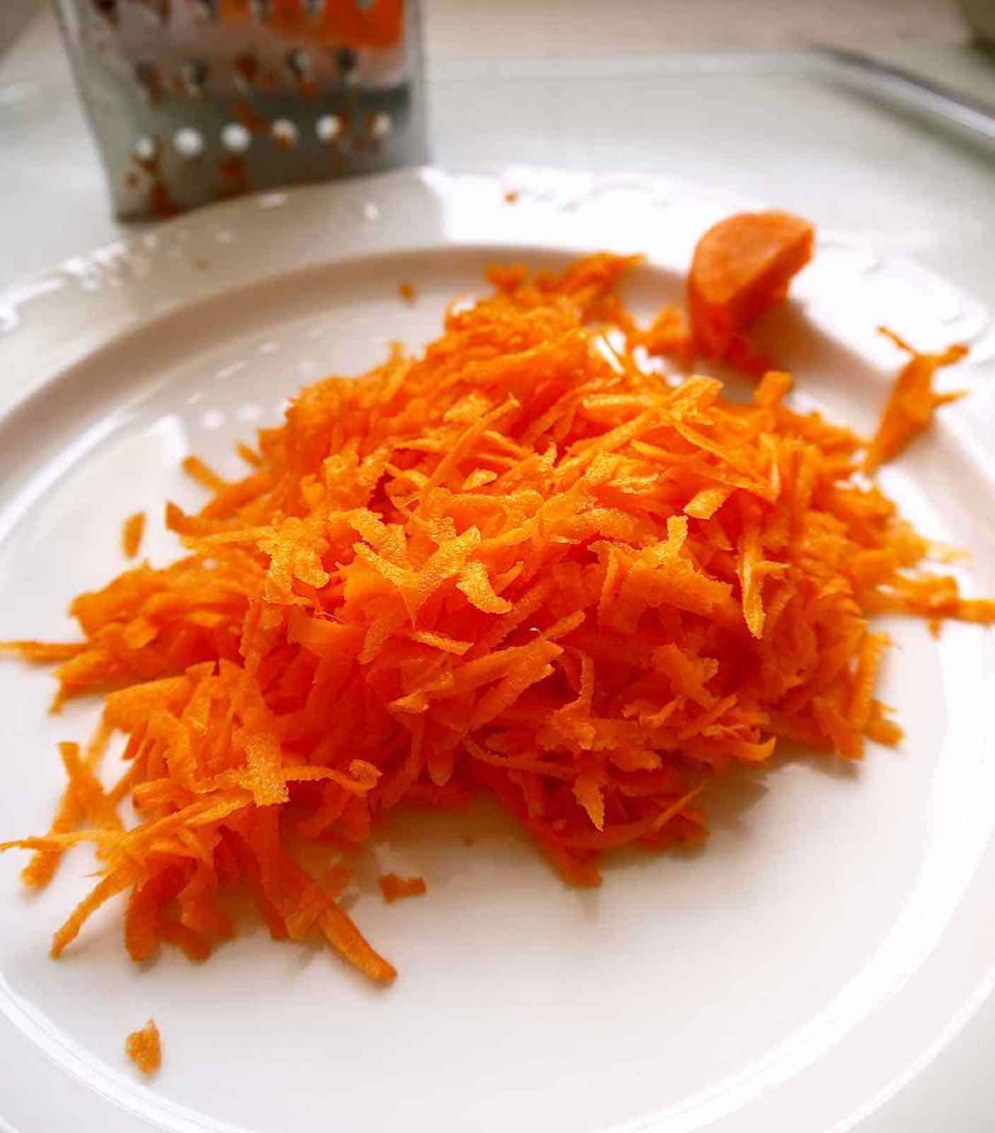 Shredded carrots on a plate.
