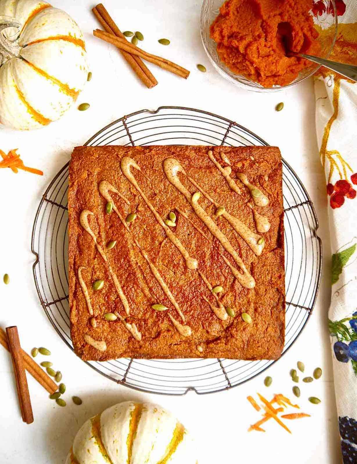 Pumpkin spice carrot cake with drizzle on.
