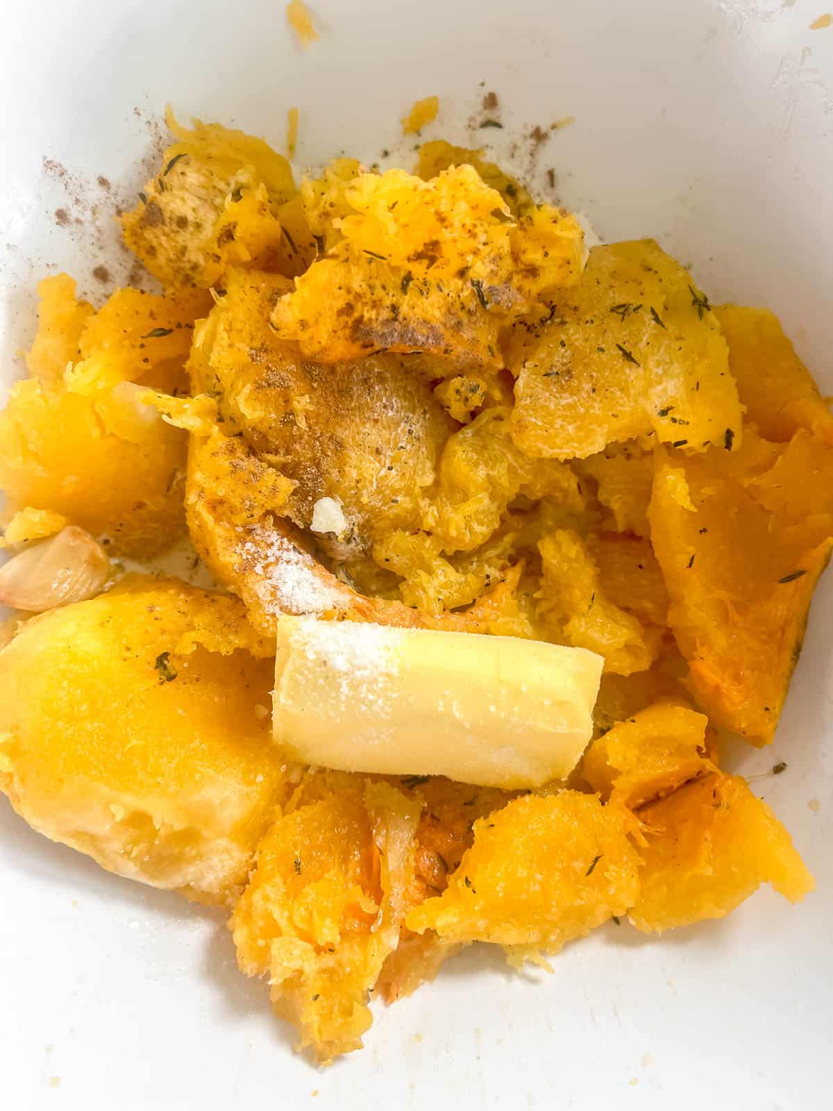 Butternut squash mash ingredients in a bowl before mashing.