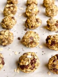 Chia Oatmeal Chocolate Chip Energy Balls lined in rows.