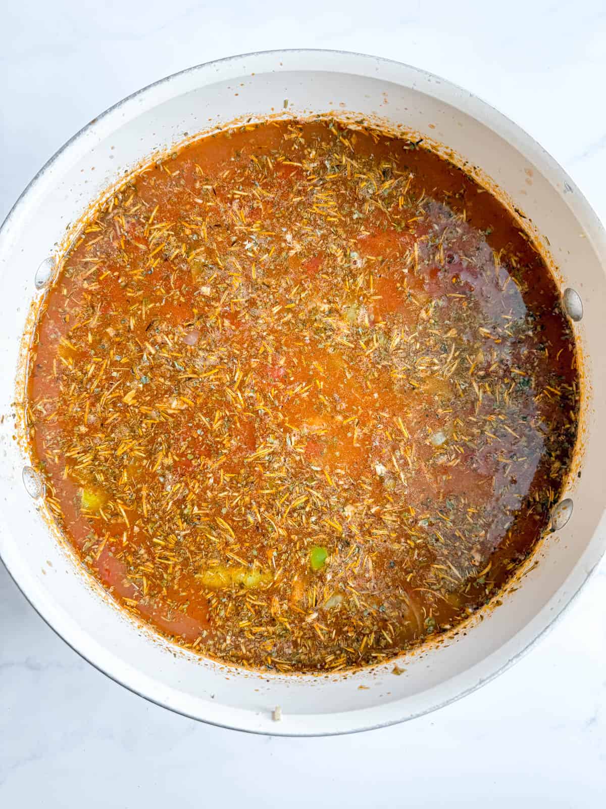 Tomato sauce, bone broth and herbs added to the tomato vegetable soup.
