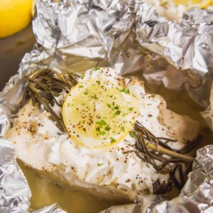 Oven baked halibut in foil with lemon and rosemary.