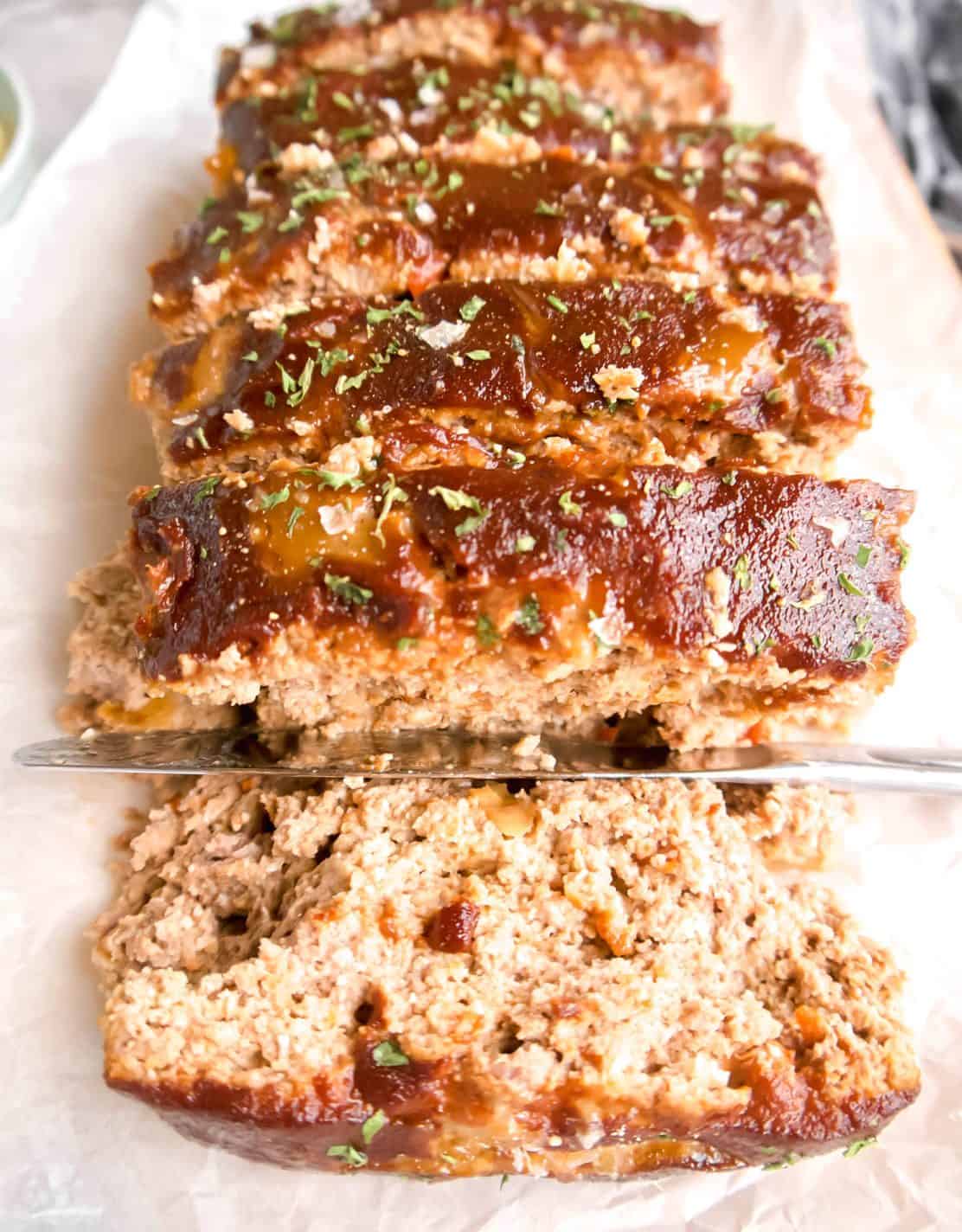 Slices of paleo meatloaf on a dish.