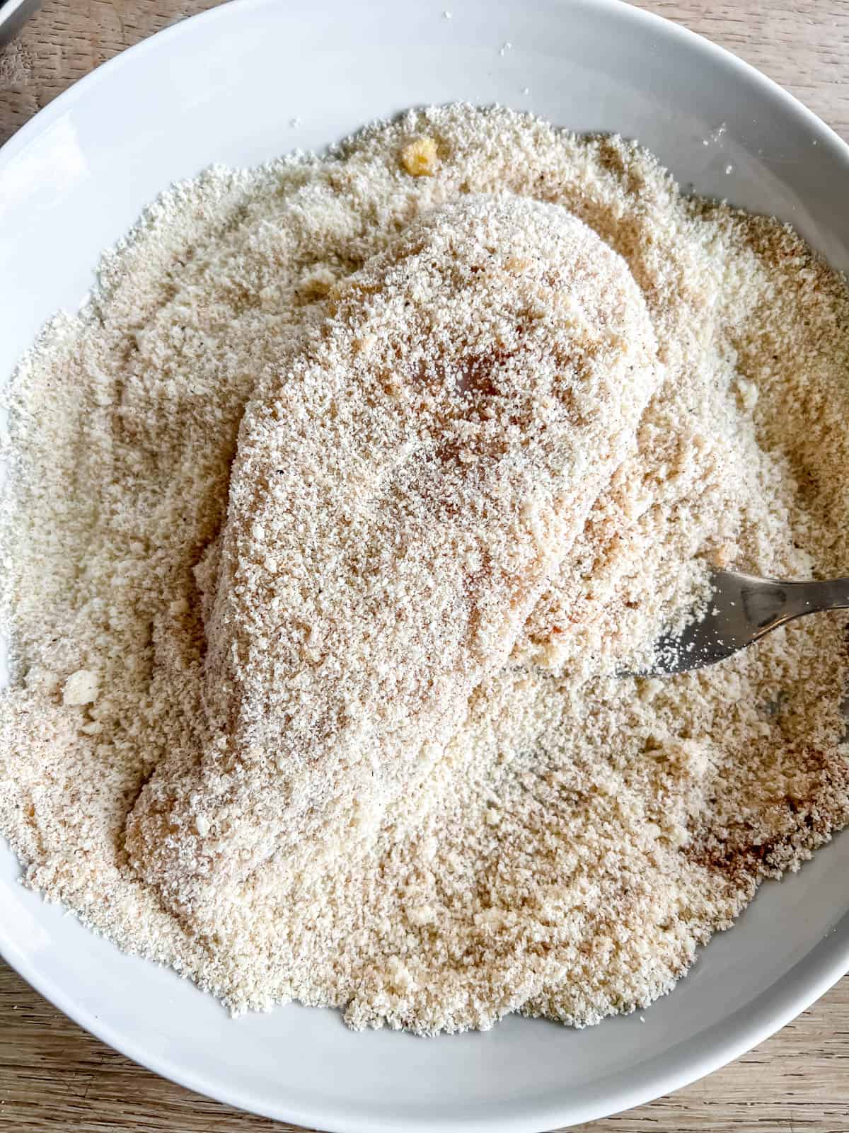 Chicken breast dunked in egg then dunked in almond flour mixture.