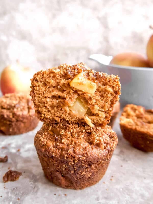 Paleo apple muffins stacked on top of each other.