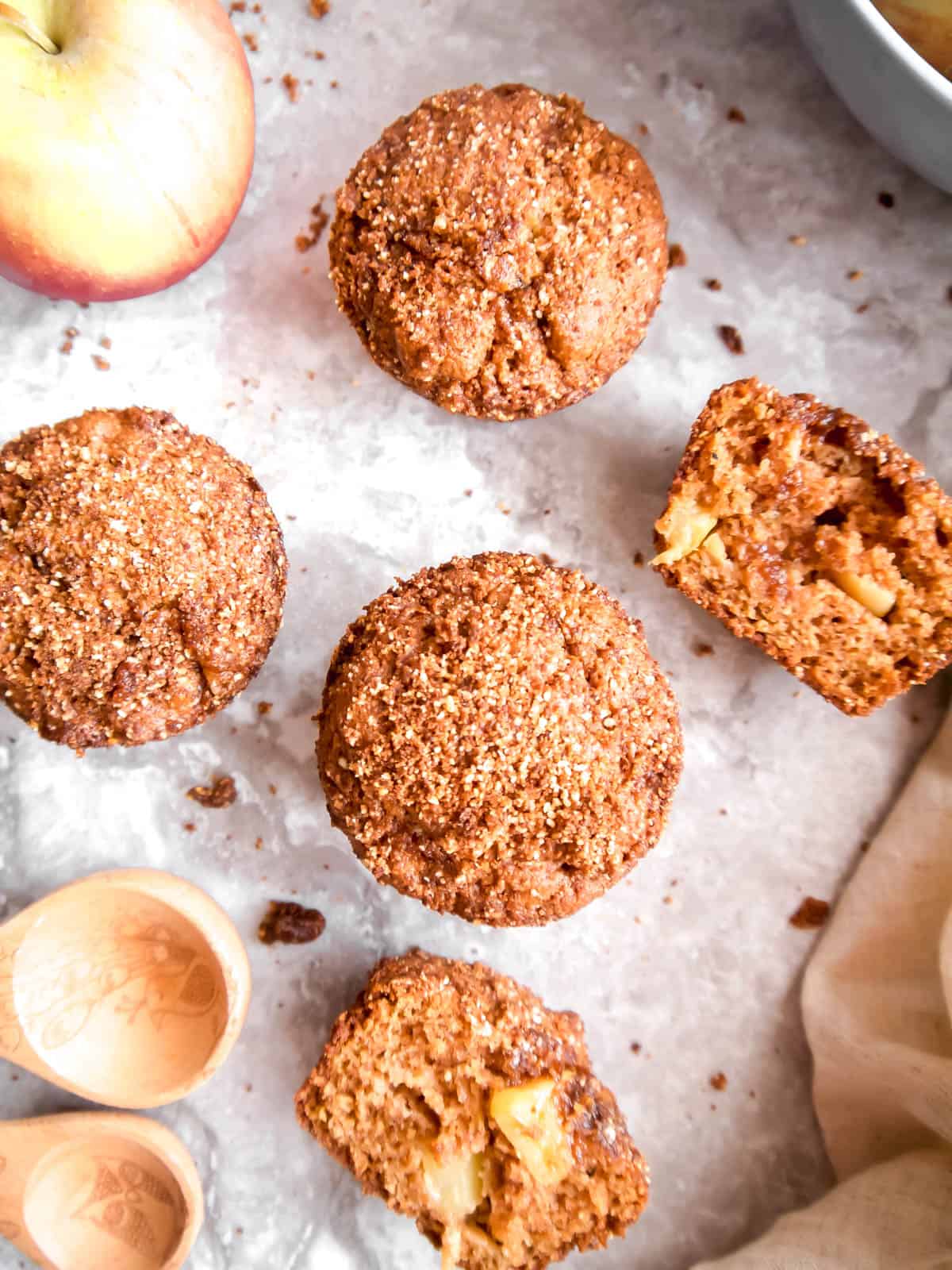 Paleo apple cinnamon muffins on a table.