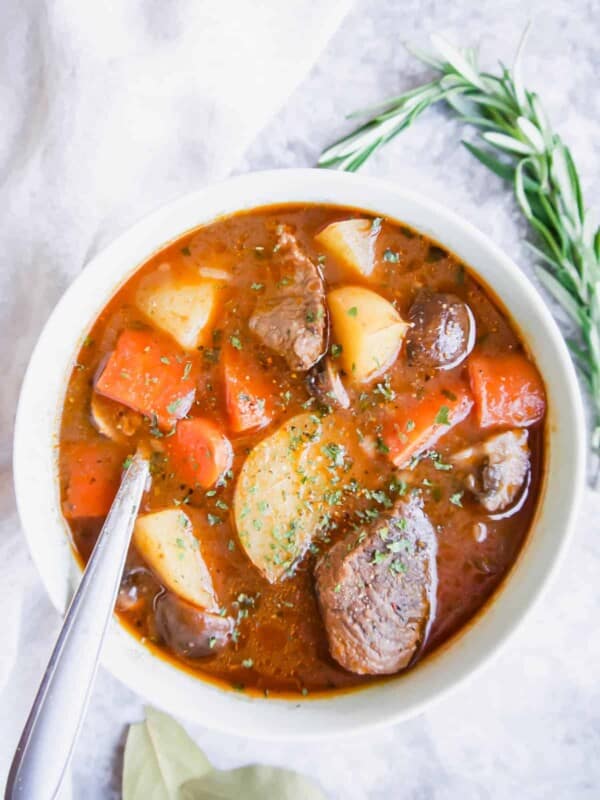 Paleo beef stew in a bowl with a spoon in the bowl.