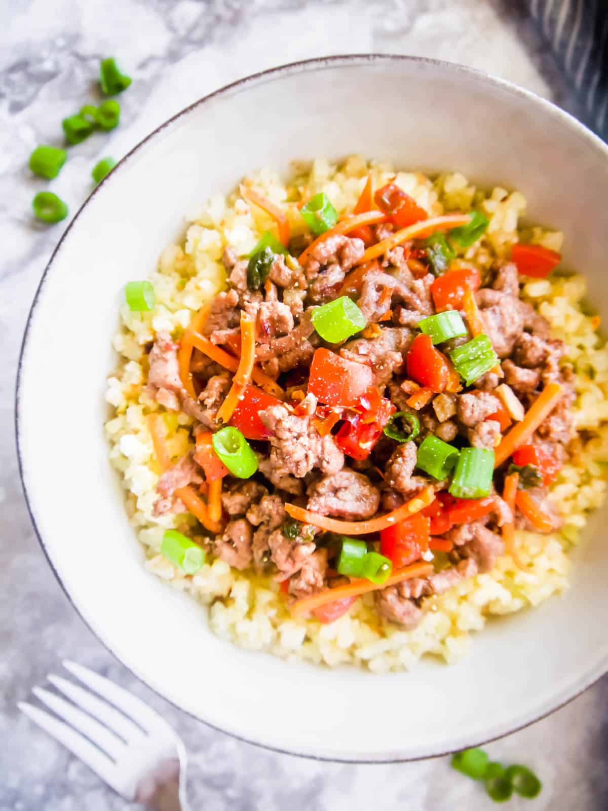 Paleo and Whole30 Korean Beef Bowl on top of cauliflower rice.