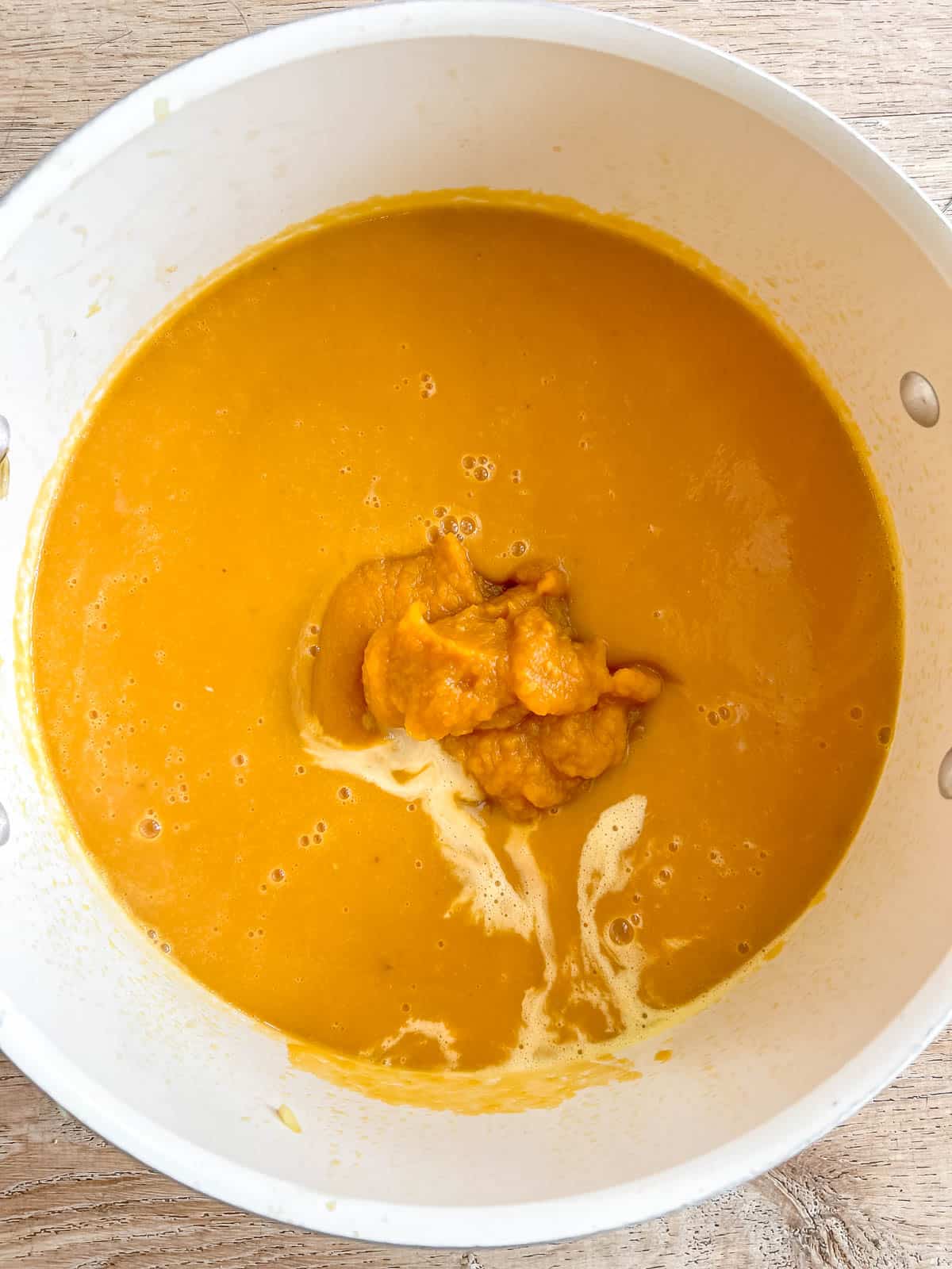 Pumpkin puree and cream added to soup.