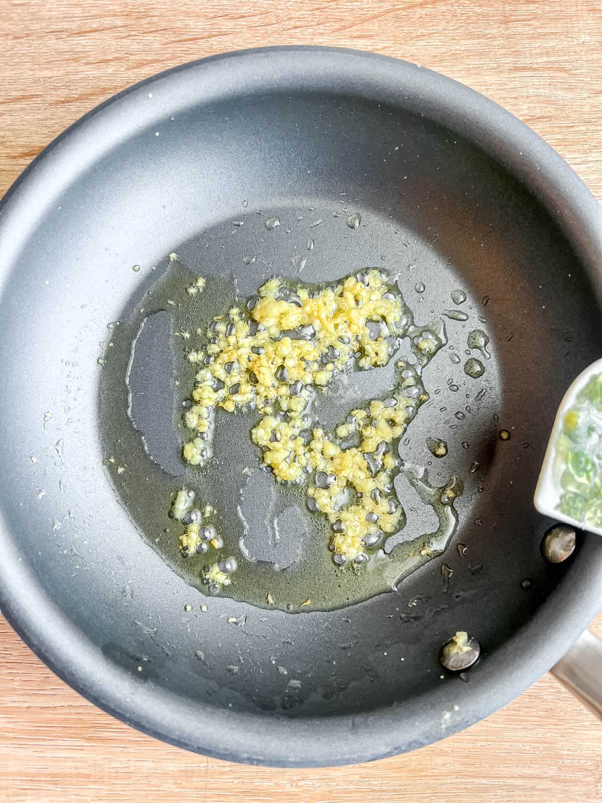 Garlic sautéing in olive oil.