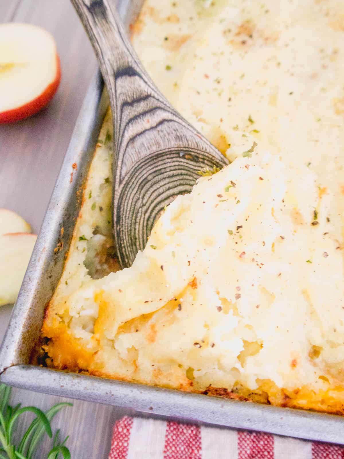 Healthy turkey shepherd's pie with a spoon in the dish.