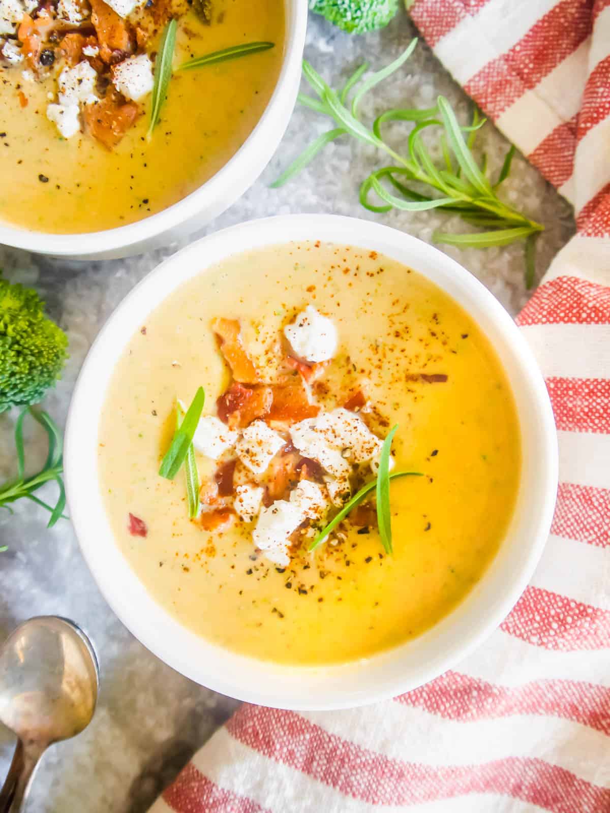 Broccoli and sweet potato soup with coconut milk in two bowls.