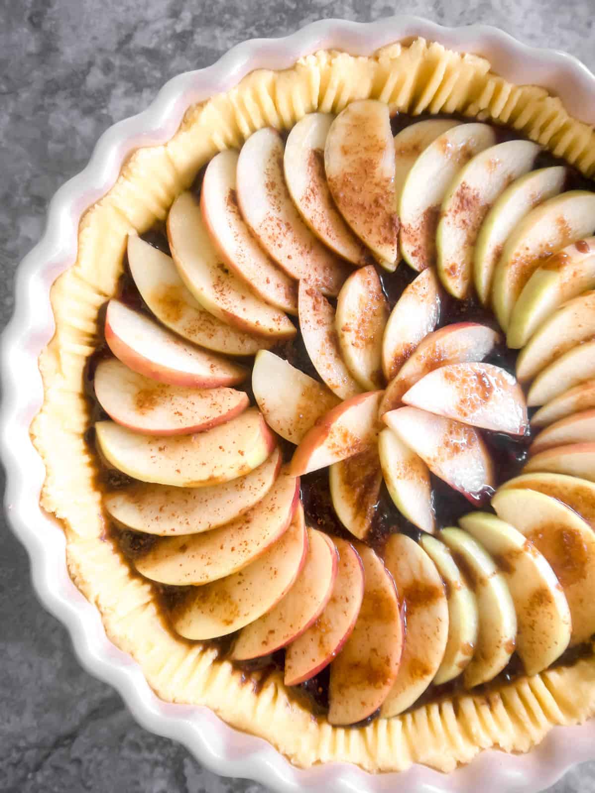 Apples added to the tart before baking.