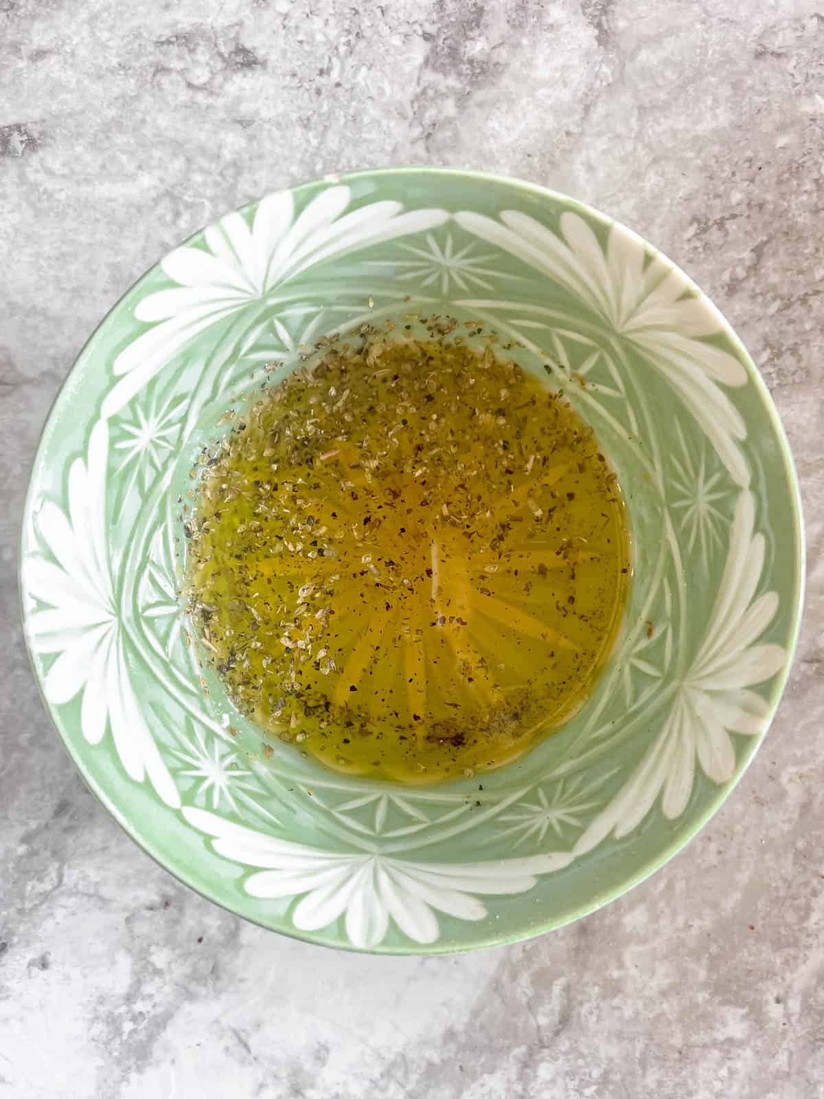 Homemade oregano dressing in a bowl.