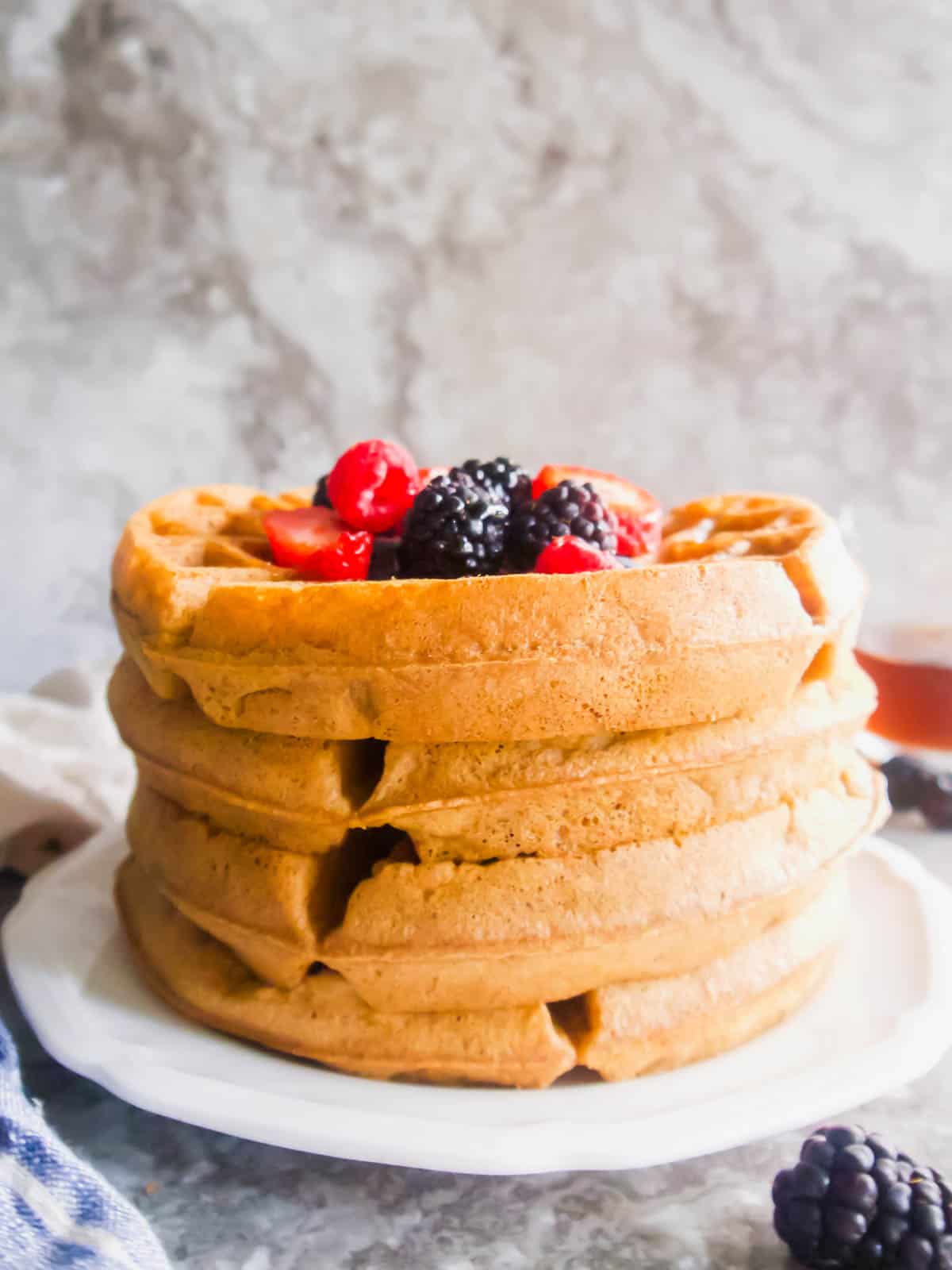 Gluten free belgian waffles stacked on top of each other. 