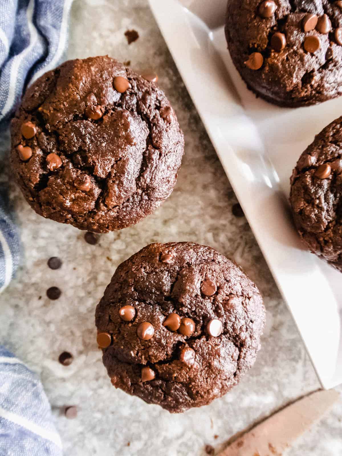A table full of chocolate paleo muffins.