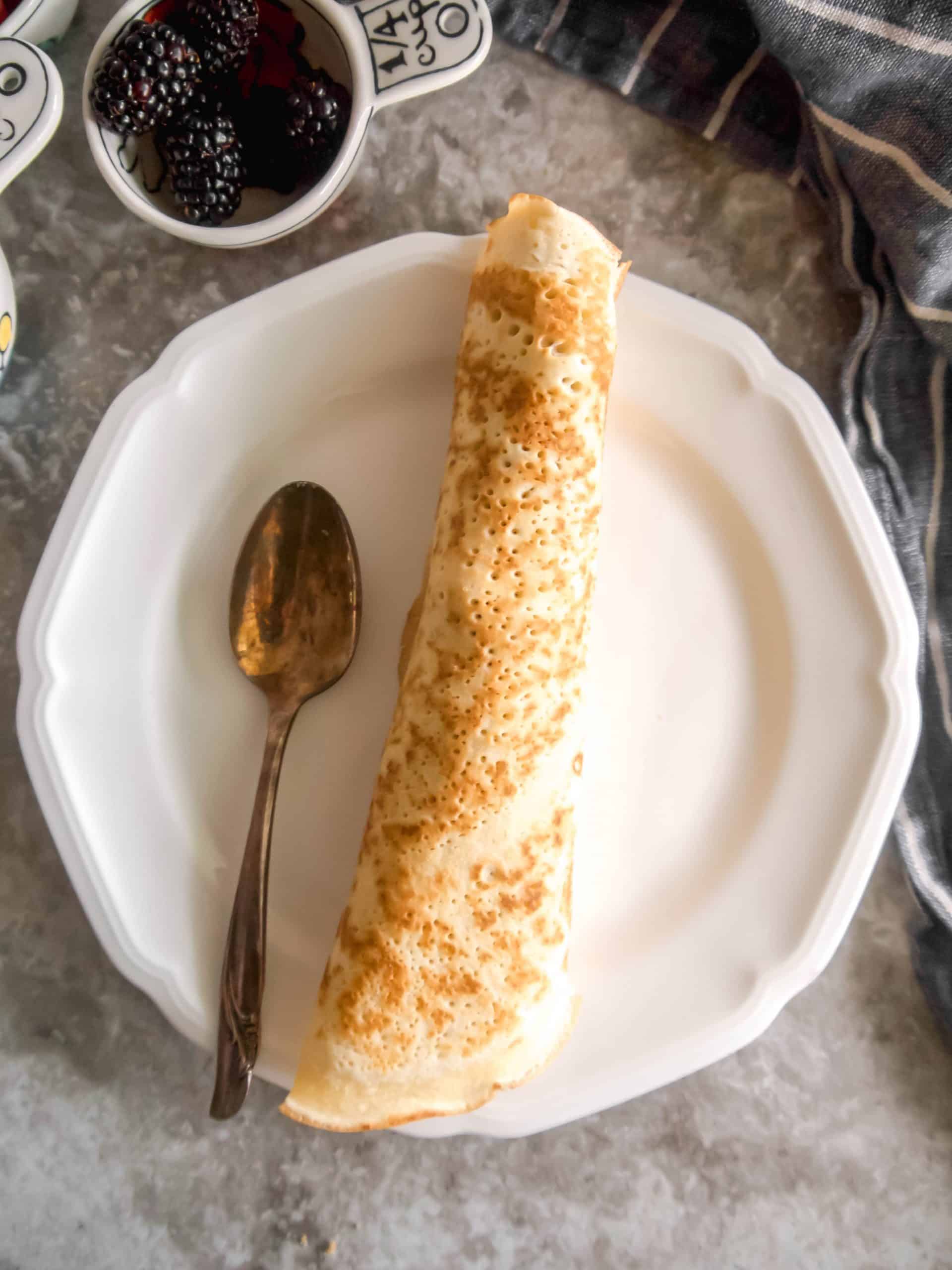 A fruit filled crepe rolled into a cigar shape.