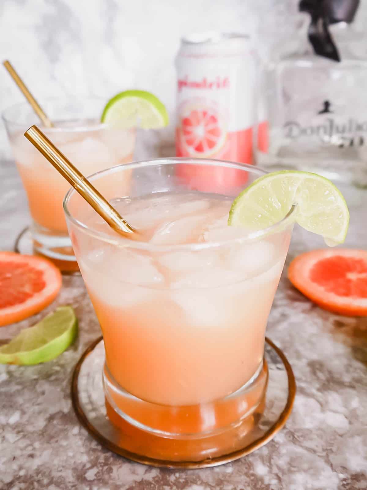 Honey paloma cocktail in two cups.