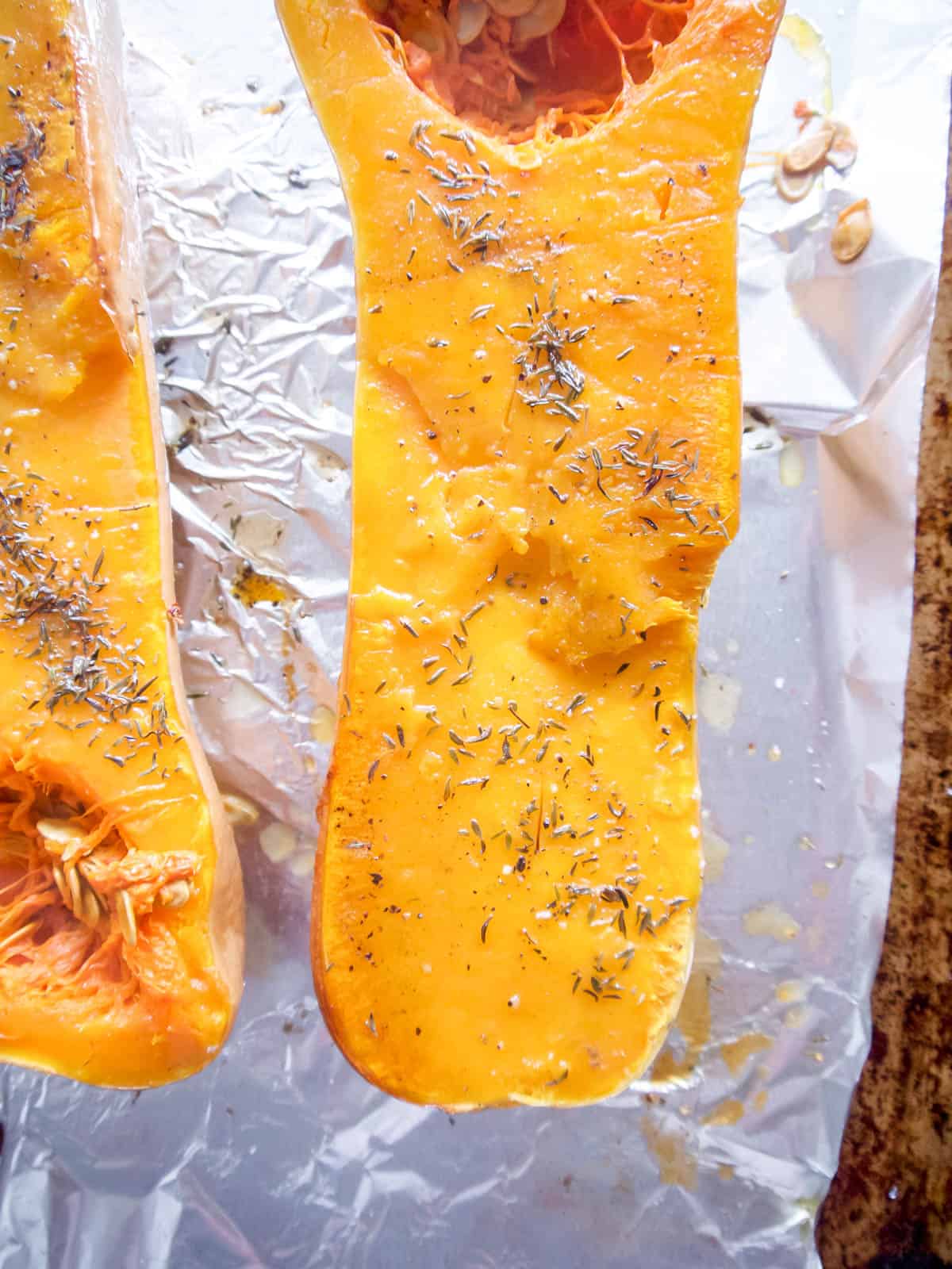 Butternut squash roasted on a pan.