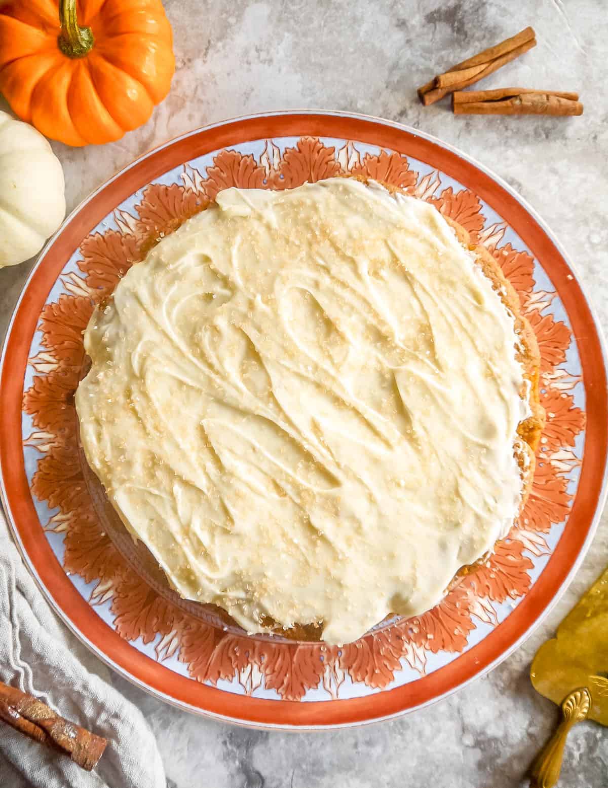 Almond flour pumpkin cake with cream cheese frosting on top.